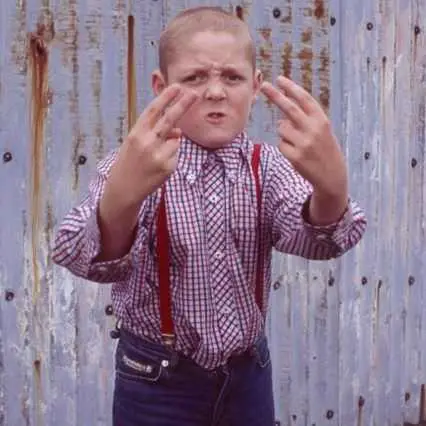 Image from a Facebook post reacting to the calculator: a child grimacing