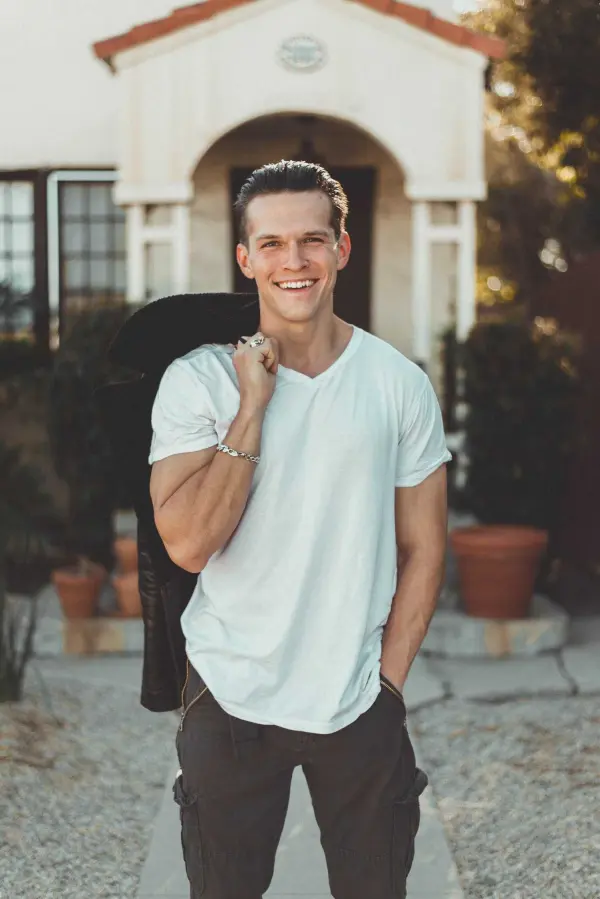 Persona photo: a young man in a white T-shirt, smiling
